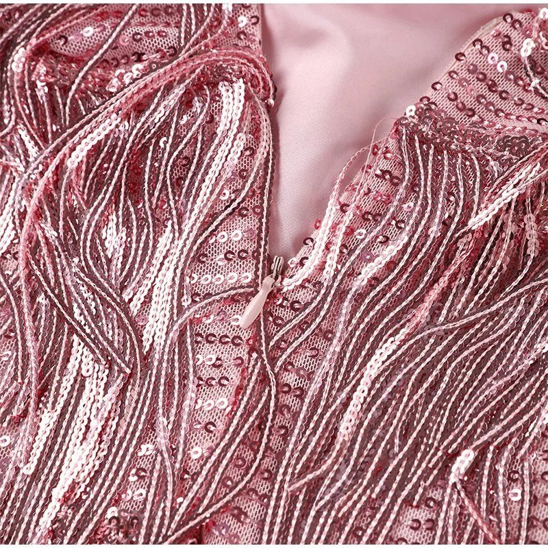 "Women's feather mini dress with elegant detailing, chic silhouette and luxurious feather accents for special occasions."