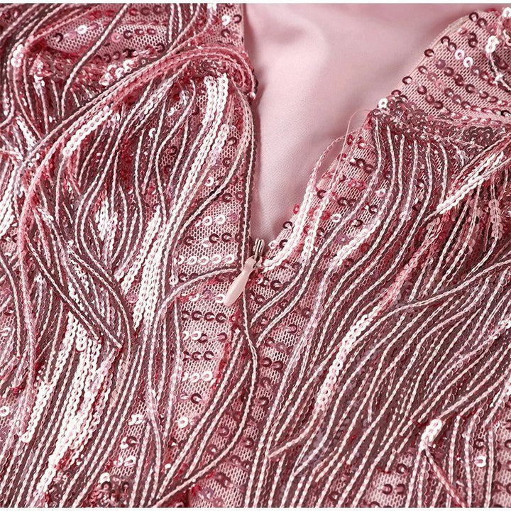 "Women's feather mini dress with elegant detailing, chic silhouette and luxurious feather accents for special occasions."