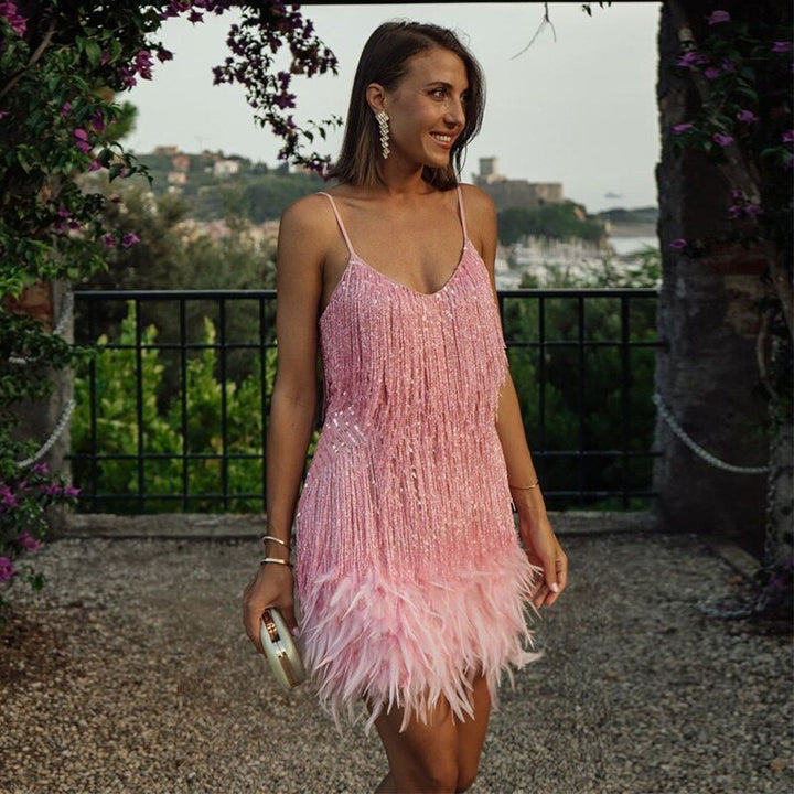 "Women's feather mini dress with elegant detailing, chic silhouette and luxurious feather accents for special occasions."