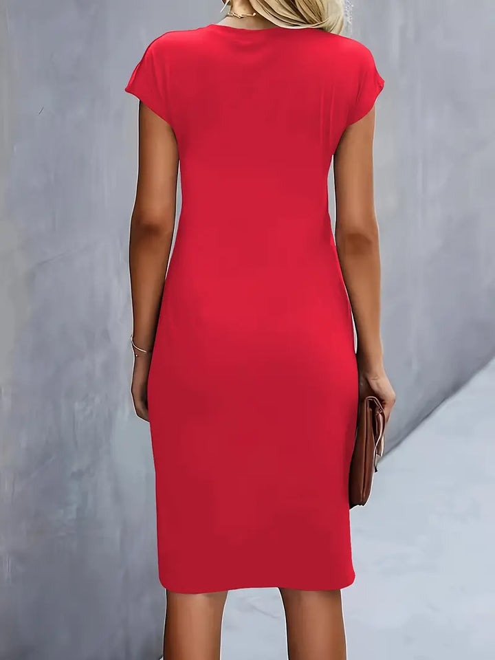 Women's knee-length sheath dress with cap sleeves and ruched waist, offering a flattering fit and elegant silhouette for any