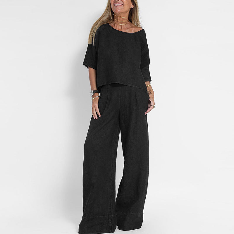 Women's linen two-piece set with a boxy top and wide-leg trousers, front view showcasing relaxed-fit and casual style.