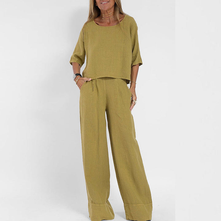 Women's linen two-piece set with a boxy top and wide-leg trousers, front view showcasing relaxed-fit and casual style.