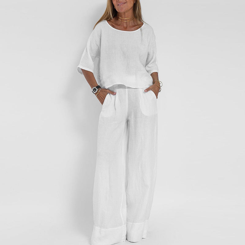 Women's linen two-piece set with a boxy top and wide-leg trousers, front view showcasing relaxed-fit and casual style.