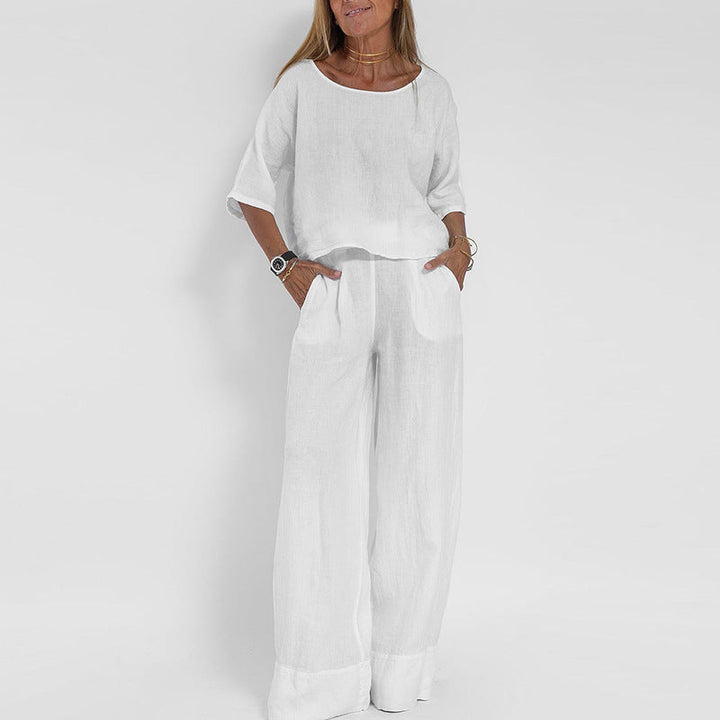Women's linen two-piece set with a boxy top and wide-leg trousers, front view showcasing relaxed-fit and casual style.