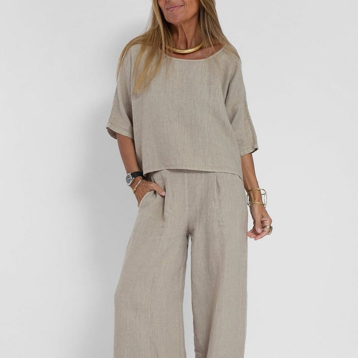 Women's linen two-piece set with a boxy top and wide-leg trousers, front view showcasing relaxed-fit and casual style.
