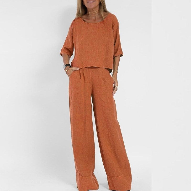Women's linen two-piece set with a boxy top and wide-leg trousers, front view showcasing relaxed-fit and casual style.