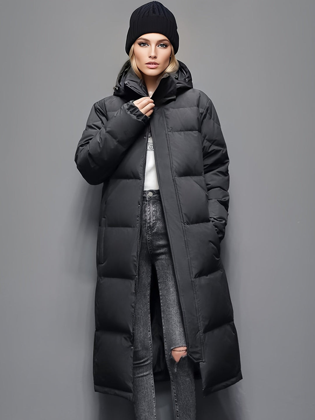 Women's long down coat with hood for autumn/winter; solid pattern, padded for warmth, chic and versatile style.