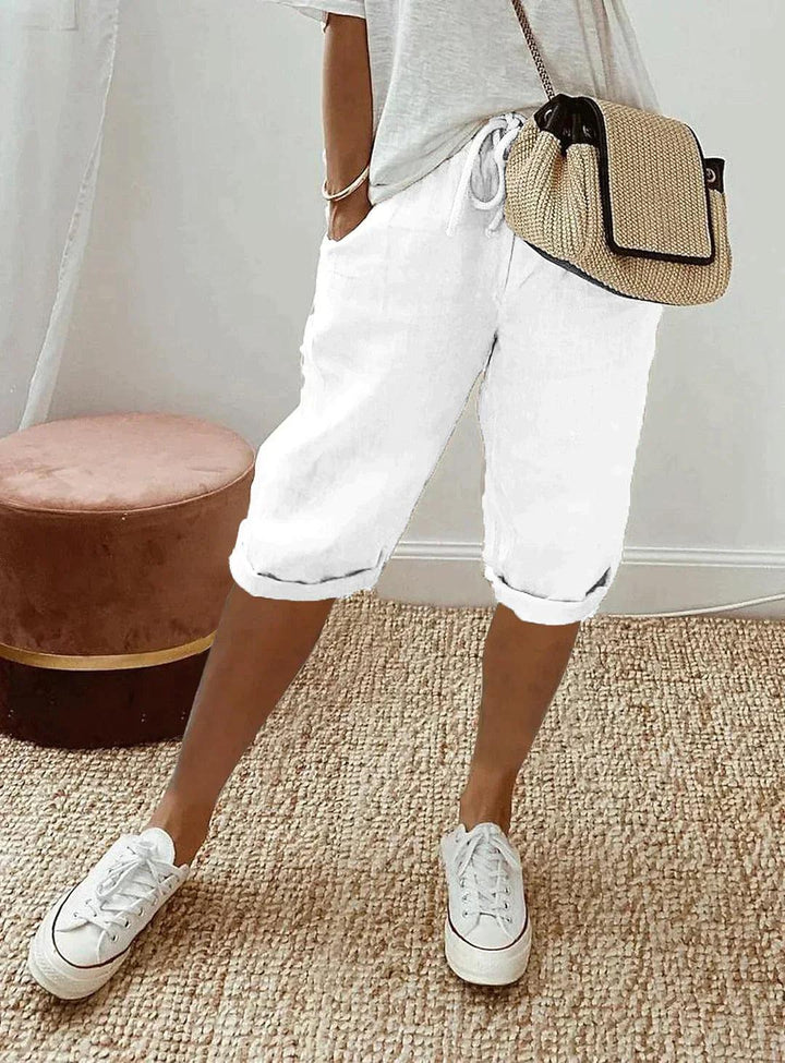 Women's loose-fit linen capri pants, front view showcasing breezy, relaxed design for casual summer style and comfort.