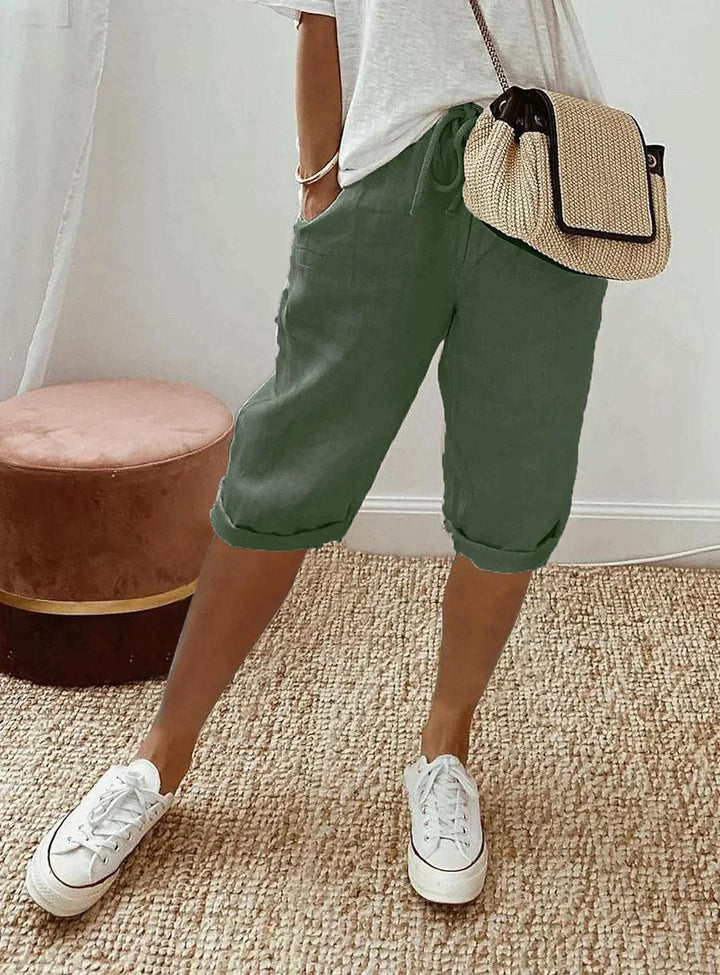Women's loose-fit linen capri pants, front view showcasing breezy, relaxed design for casual summer style and comfort.