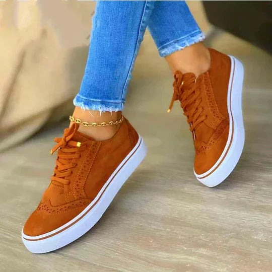 Women's orthopedic lace-up sneakers showcasing ergonomic insole, synthetic upper, and versatile colors for comfort and style.