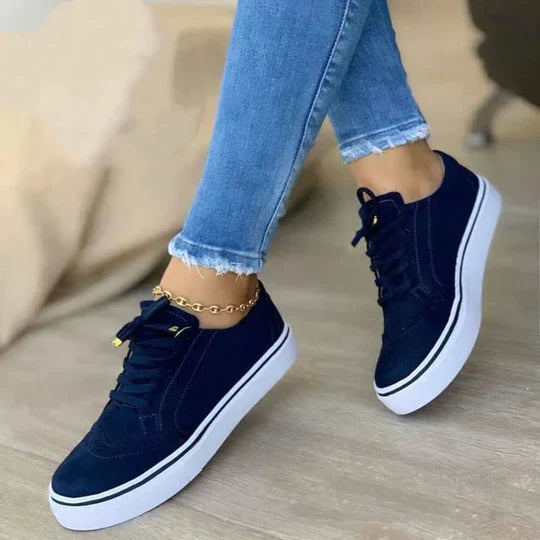 Women's orthopedic lace-up sneakers showcasing ergonomic insole, synthetic upper, and versatile colors for comfort and style.