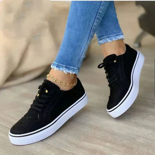 Women's orthopedic lace-up sneakers showcasing ergonomic insole, synthetic upper, and versatile colors for comfort and style.
