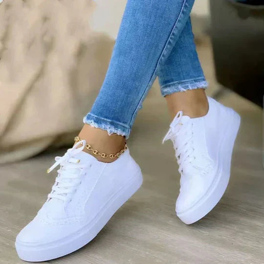 Women's orthopedic lace-up sneakers showcasing ergonomic insole, synthetic upper, and versatile colors for comfort and style.