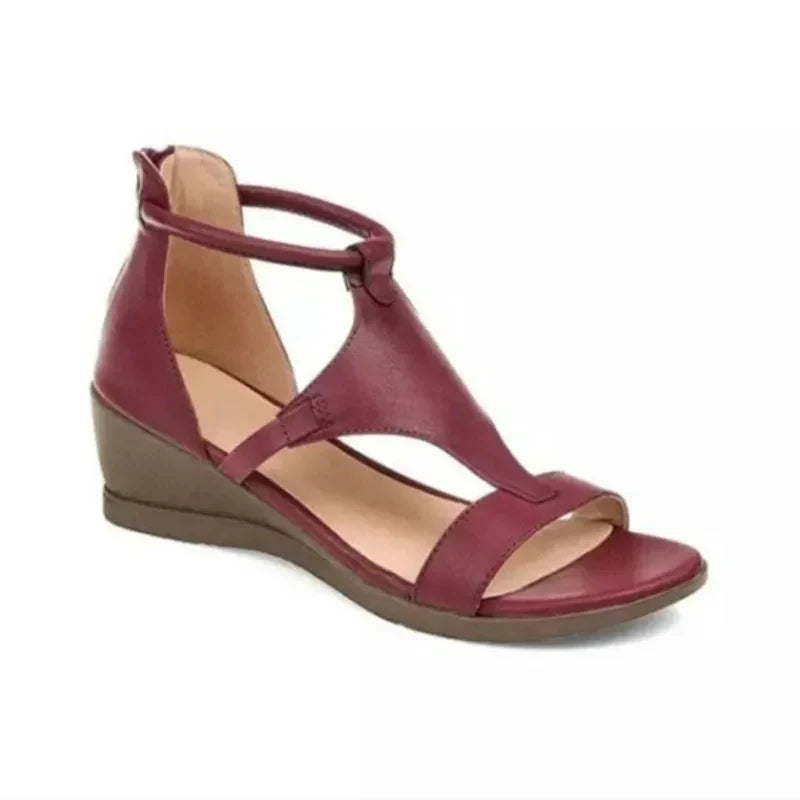 Women's orthopedic leather sandals with adjustable straps, featuring a supportive sole and breathable design.