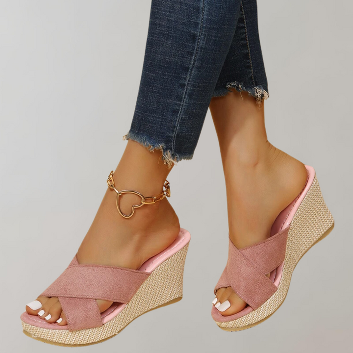 "Women's orthopedic wedge sandals with chic crisscross straps, cushioned arch support, and supportive wedge design."