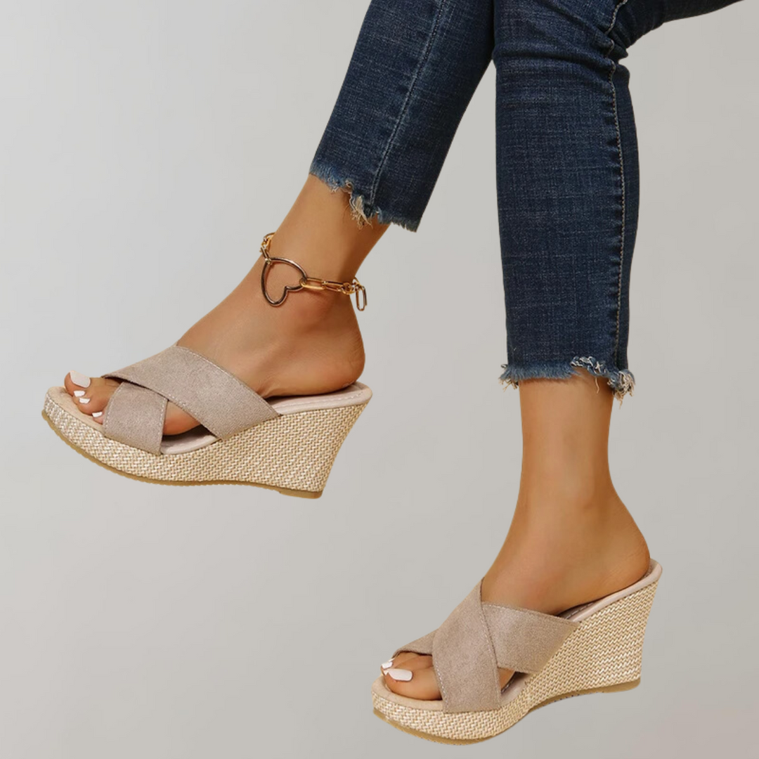 "Women's orthopedic wedge sandals with chic crisscross straps, cushioned arch support, and supportive wedge design."