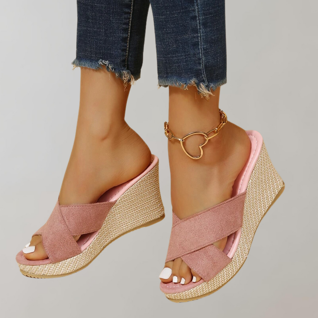 "Women's orthopedic wedge sandals with chic crisscross straps, cushioned arch support, and supportive wedge design."