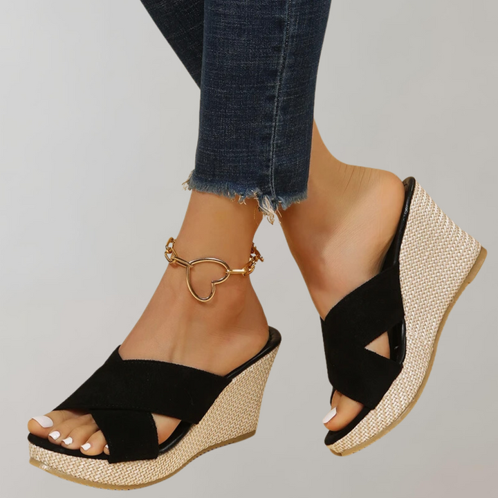 "Women's orthopedic wedge sandals with chic crisscross straps, cushioned arch support, and supportive wedge design."