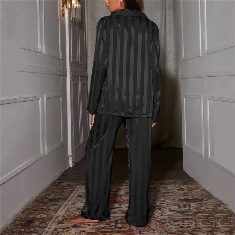 "Women's silk-feel pyjama set, front view: luxurious loungewear with button-down top, matching trousers, elegant sheen."