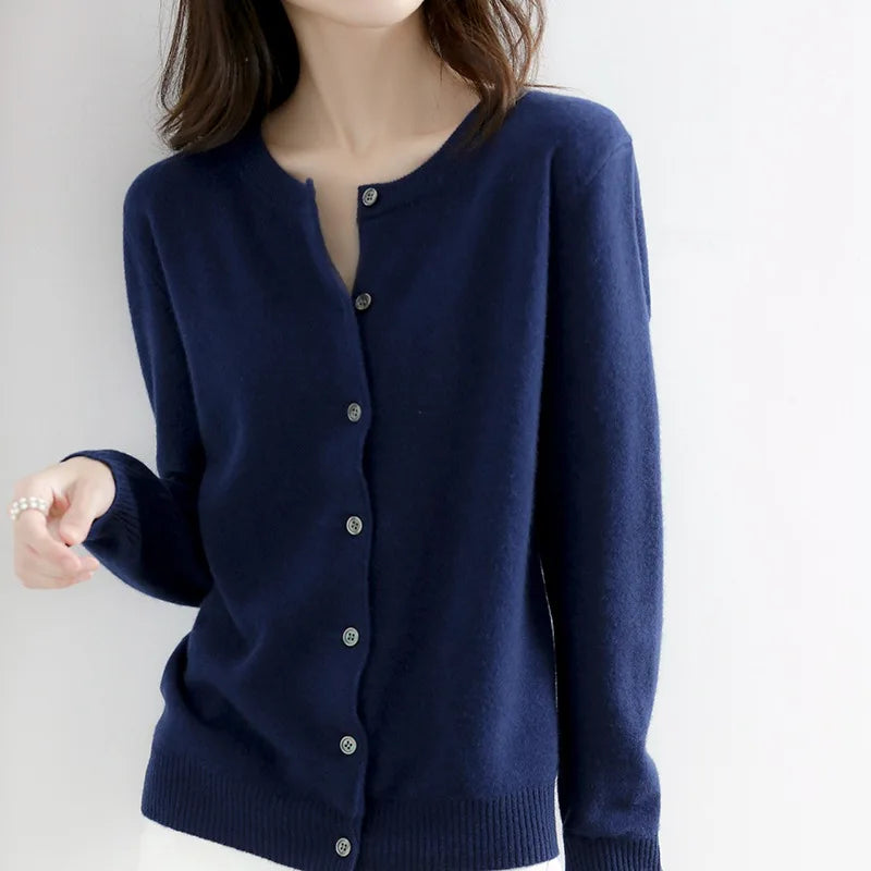 Women's soft cashmere button-up cardigan, classic design, long sleeves, versatile for casual and formal outfits.