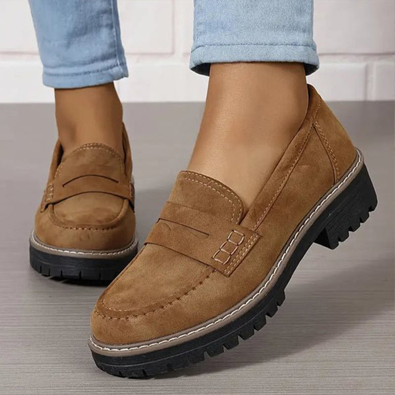 "Women's suede loafers with chunky sole and vamp strap, featuring rounded toe and premium suede for casual elegance."