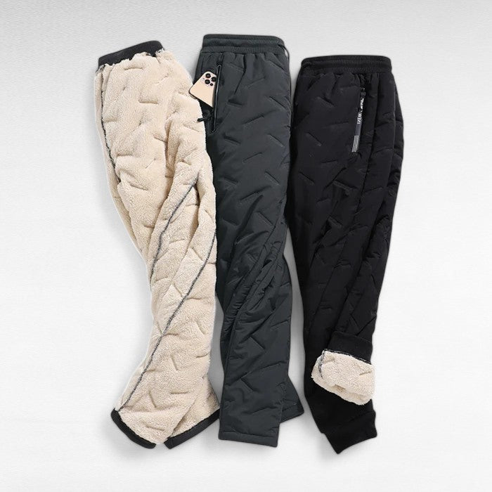 Women's thermal waterproof fleece-lined trousers, black, fleece interior, zippered pockets, ideal winter outdoor wear.