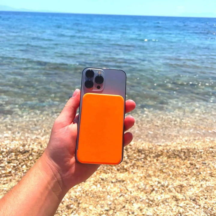 "10,000mAh MagSafe power bank for iPhone, sleek design, wireless charging, vibrant colors, portable, lightweight."