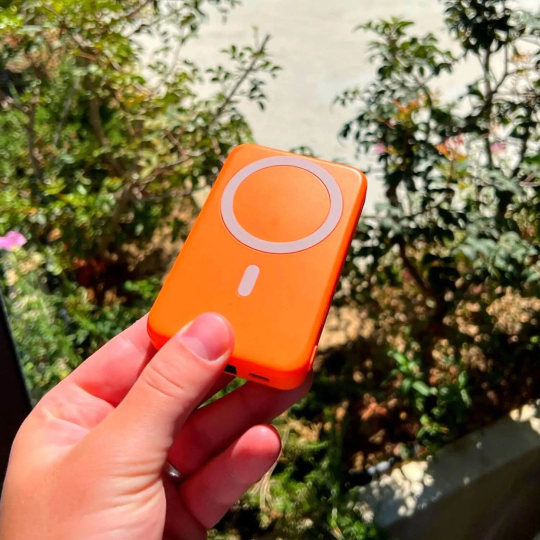 "10,000mAh MagSafe power bank for iPhone, sleek design, wireless charging, vibrant colors, portable, lightweight."