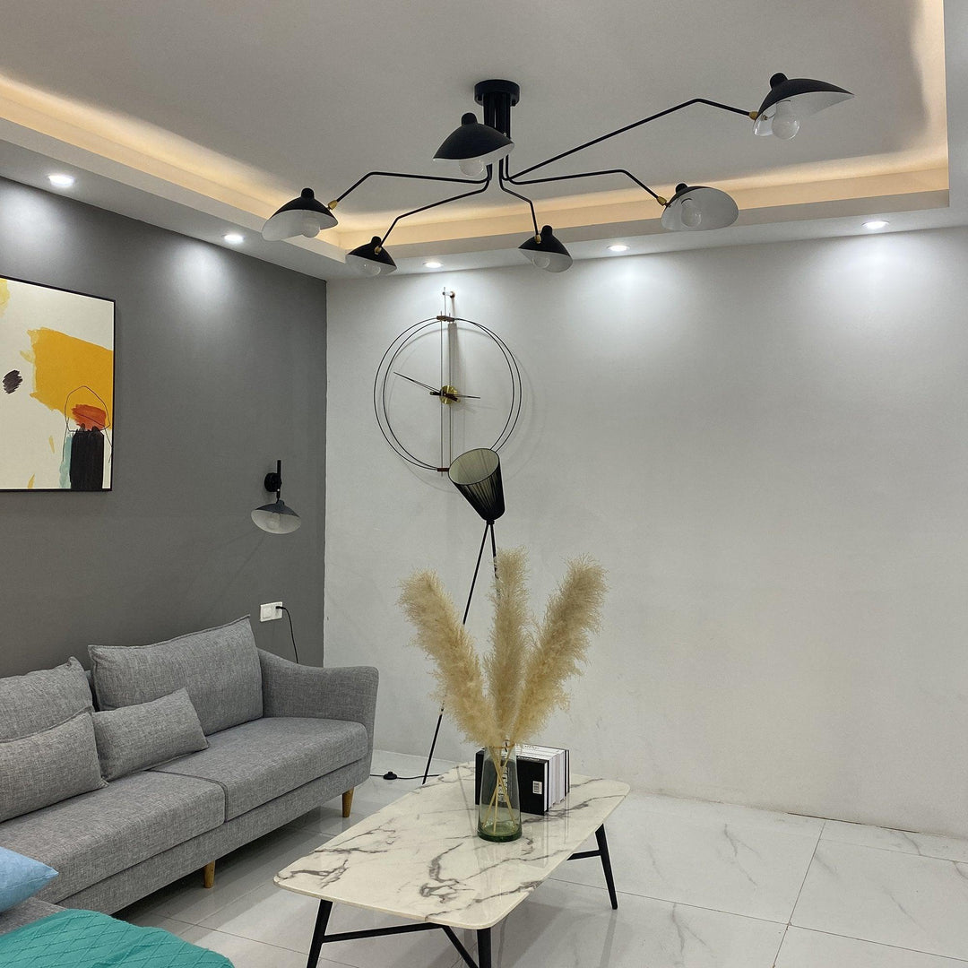 "Adjustable ceiling light with multiple arms, minimalist design, ideal for modern interiors, made of steel and aluminium."