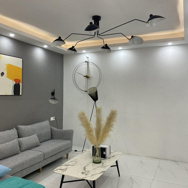 "Adjustable ceiling light with multiple arms, minimalist design, ideal for modern interiors, made of steel and aluminium."