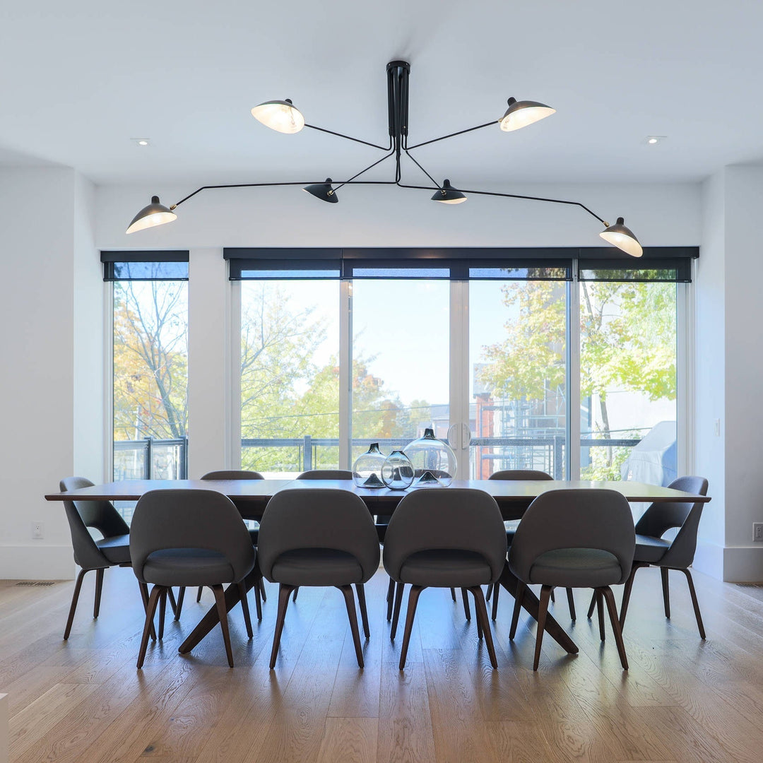 "Adjustable ceiling light with multiple arms, minimalist design, ideal for modern interiors, made of steel and aluminium."