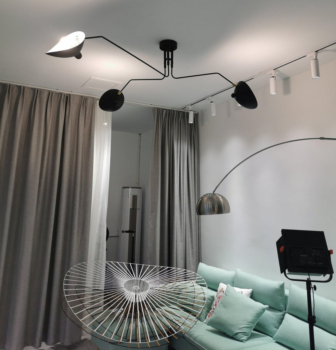 "Adjustable ceiling light with multiple arms, minimalist design, ideal for modern interiors, made of steel and aluminium."