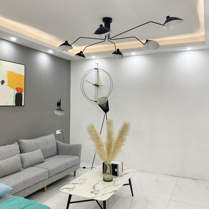 "Adjustable ceiling light with multiple arms, minimalist design, ideal for modern interiors, made of steel and aluminium."