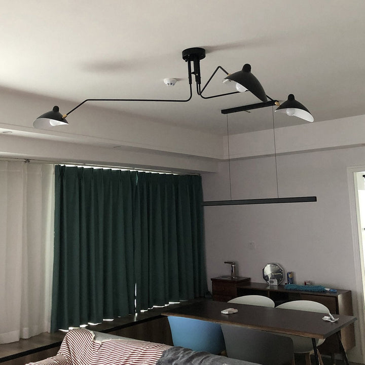 "Adjustable ceiling light with multiple arms, minimalist design, ideal for modern interiors, made of steel and aluminium."