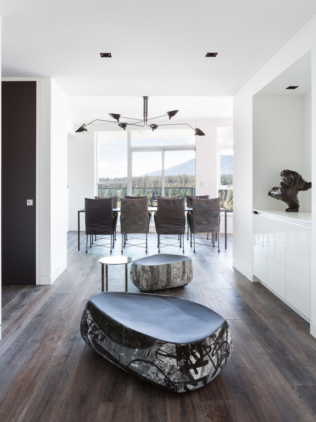 "Adjustable ceiling light with multiple arms, minimalist design, ideal for modern interiors, made of steel and aluminium."