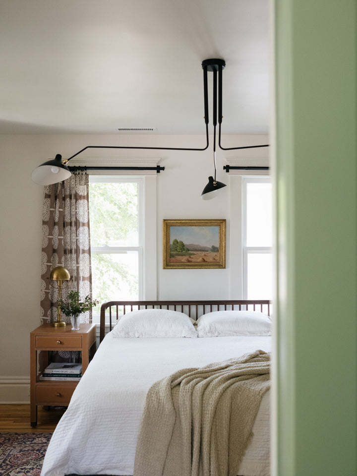 "Adjustable ceiling light with multiple arms, minimalist design, ideal for modern interiors, made of steel and aluminium."