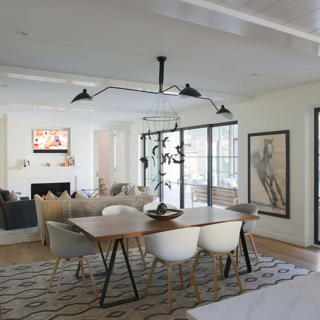 "Adjustable ceiling light with multiple arms, minimalist design, ideal for modern interiors, made of steel and aluminium."