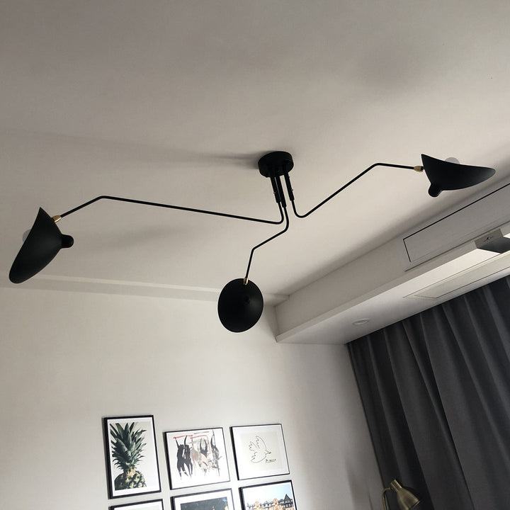 "Adjustable ceiling light with multiple arms, minimalist design, ideal for modern interiors, made of steel and aluminium."