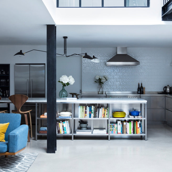 "Adjustable ceiling light with multiple arms, minimalist design, ideal for modern interiors, made of steel and aluminium."