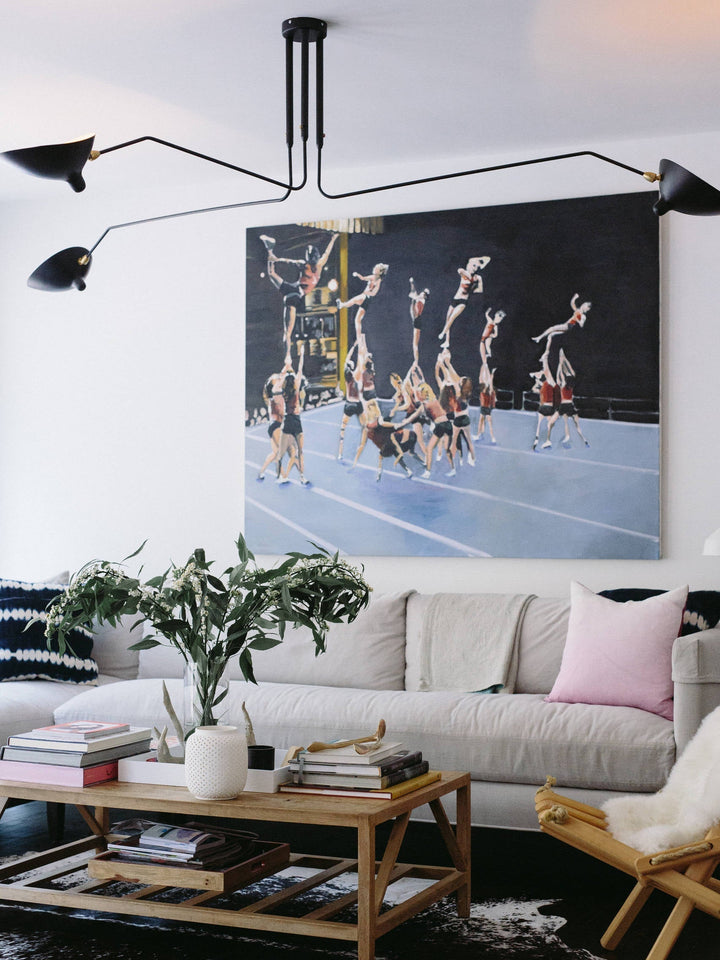 "Adjustable ceiling light with multiple arms, minimalist design, ideal for modern interiors, made of steel and aluminium."