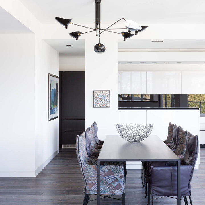 "Adjustable ceiling light with multiple arms, minimalist design, ideal for modern interiors, made of steel and aluminium."