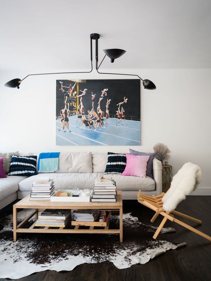"Adjustable ceiling light with multiple arms, minimalist design, ideal for modern interiors, made of steel and aluminium."