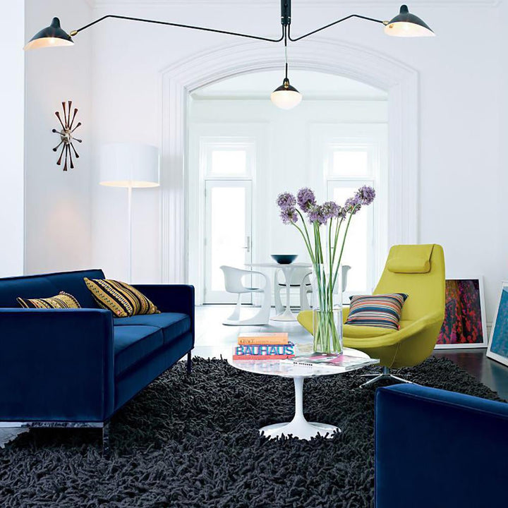 "Adjustable ceiling light with multiple arms, minimalist design, ideal for modern interiors, made of steel and aluminium."