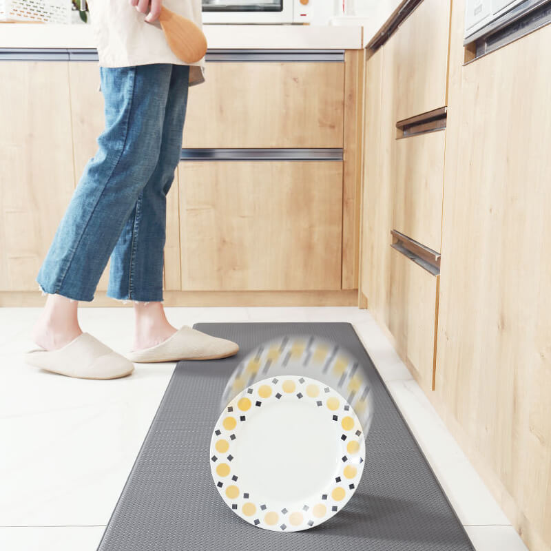 "Anti-slip waterproof kitchen rug with comfort cushioning, durable PVC, two-sided no-slip design, in grey rhombus pattern."