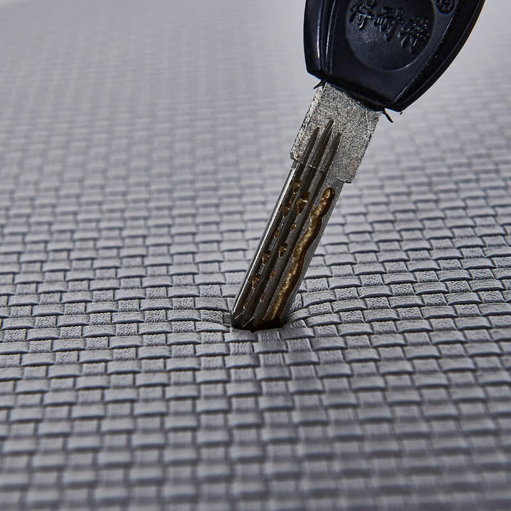 "Anti-slip waterproof kitchen rug with comfort cushioning, durable PVC, two-sided no-slip design, in grey rhombus pattern."