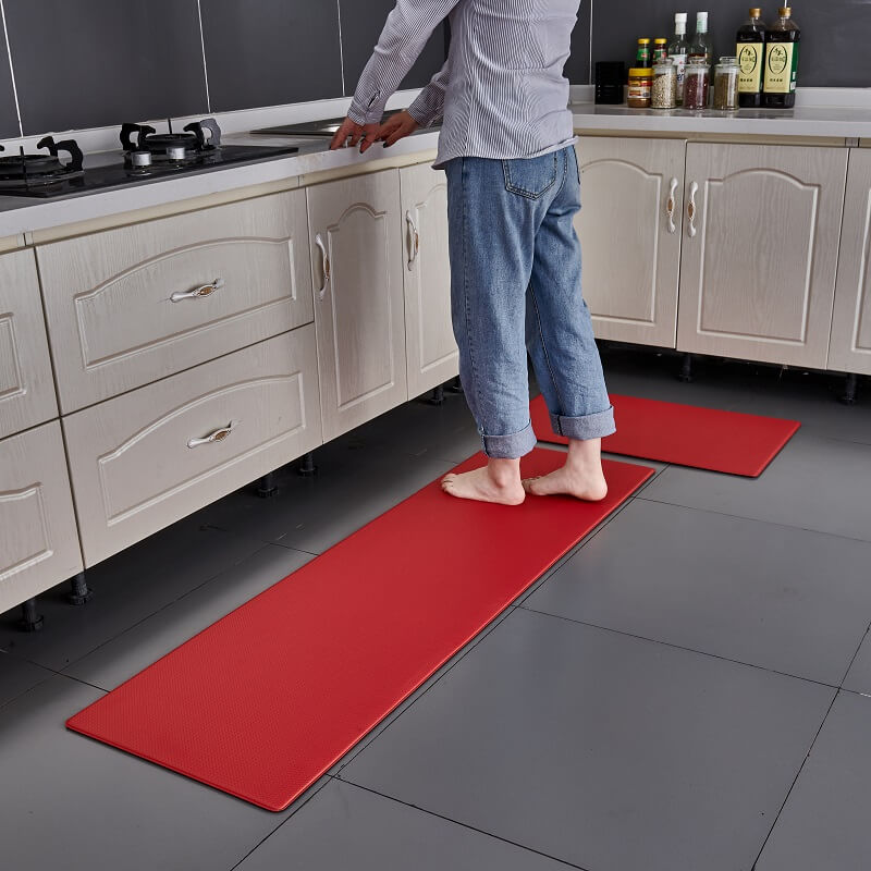 "Anti-slip waterproof kitchen rug with comfort cushioning, durable PVC, two-sided no-slip design, in grey rhombus pattern."