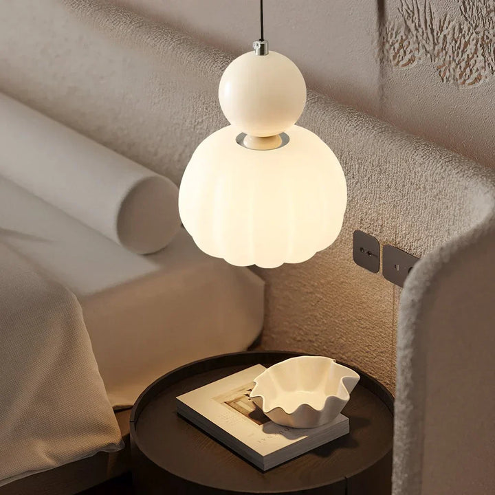 "Art Deco Cream Pendant Light with Bauhaus design, features high-quality metal frame and warm glow for elegant home lighting.