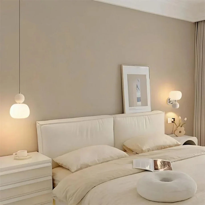 "Art Deco Cream Pendant Light with Bauhaus design, features high-quality metal frame and warm glow for elegant home lighting.