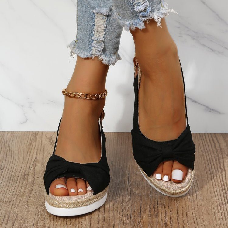 Beige women's wedge sandals with chic knot detail, open toe, slingback strap, and braided jute platform for summer style.