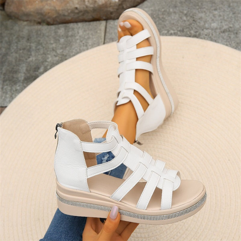 Beige women's wedge sandals with glittering rhinestone accents, offering elegant style and comfort for summer outings.